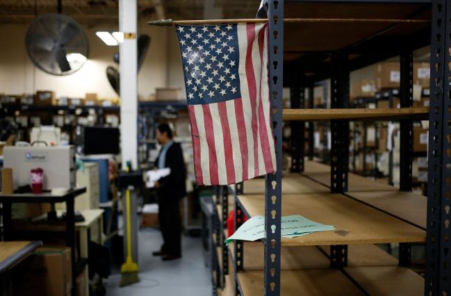 © Bloomberg. A American flag is displayed on the factory floor at the Holley Performance Products Inc. manufacturing facility in Bowling Green, Kentucky, U.S., on Friday, Dec. 18, 2015.  Photographer: Luke Sharrett/Bloomberg