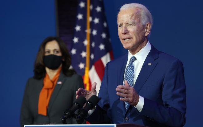 © Bloomberg. WILMINGTON, DELAWARE - NOVEMBER 09: U.S. President-elect Joe Biden speaks to the media while flanked by Vice President-elect Kamala Harris, at the Queen Theater after receiving a briefing from the transition COVID-19 advisory board on November 09, 2020 in Wilmington, Delaware. Mr. Biden spoke about how his administration would respond to the coronavirus pandemic. (Photo by Joe Raedle/Getty Images)