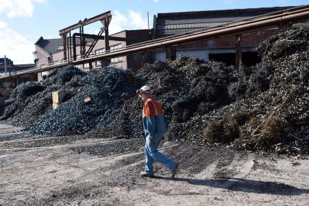 © OLI SCARFF/AFP/Getty Images. The British economy's future may be uncertain, but it still grew for the 10th consecutive quarter. Pictured: A worker walked past metal shavings in the Scrap Yard of Sheffield Forgemasters International Ltd. in Sheffield, northern England, Aug. 27, 2015.