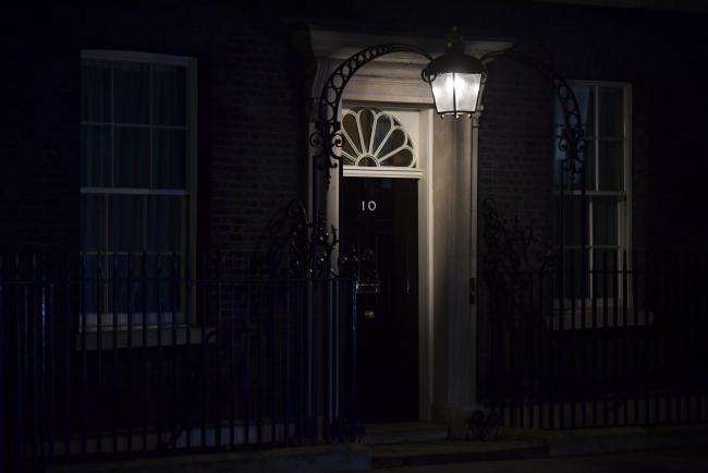 © Bloomberg. A lamp illuminates the door at number 10 Downing Street in London, U.K., on Tuesday, March 12, 2019. U.K. Prime Minister Theresa May struck a deal to revise the terms of the U.K.'s divorce from the European Union but it's unclear whether she's done enough to win Parliament's support in a crucial vote on Tuesday. Photographer: Chris J. Ratcliffe/Bloomberg