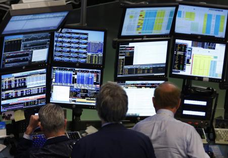 © REUTERS/Brendan McDermid. The Commodity Futures Trading Commission will reportedly announce rules that could fundamentally alter the 0 trillion swaps market, currently dominated by a handful of large Wall Street banks. Above, traders work at Bloomberg terminals on the floor of the New York Stock Exchange, May 13, 2013.