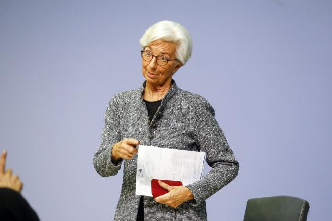 © Bloomberg. Christine Lagarde, president of the European Central Bank (ECB), speaks to a journalist as she departs the central bank's rate decision news conference in Frankfurt, Germany, on Thursday, March 12, 2020. Lagarde urged governments to stop dithering in their economic response to the coronavirus as she warned that the outbreak already constitutes a “major shock” to global growth prospects. Photographer: Alex Kraus/Bloomberg