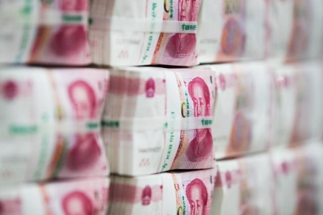 © Bloomberg. Genuine bundles of Chinese one-hundred yuan banknotes are arranged for a photograph at the Counterfeit Notes Response Center of KEB Hana Bank in Seoul, South Korea, on Monday, Aug. 14, 2017. China's factory output and investment slowed somewhat in July, according to data released today, yet the yuan appeared not to take the data as negative, if in fact it's paying attention to it at all. Photographer: SeongJoon Cho/Bloomberg