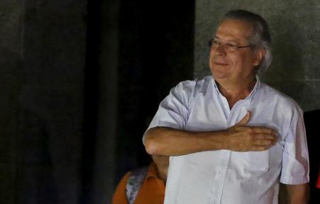 © Reuters/Nacho Doce. Former presidential chief of staff Jose Dirceu was arrested Tuesday in the Petrobras corruption scandal. In this photo, dated Nov. 15, 2013, Dirceu gestures to supporters as he turns himself in to federal police after an arrest warrant was issued for him to begin a jail sentence for vote-buying scandal.