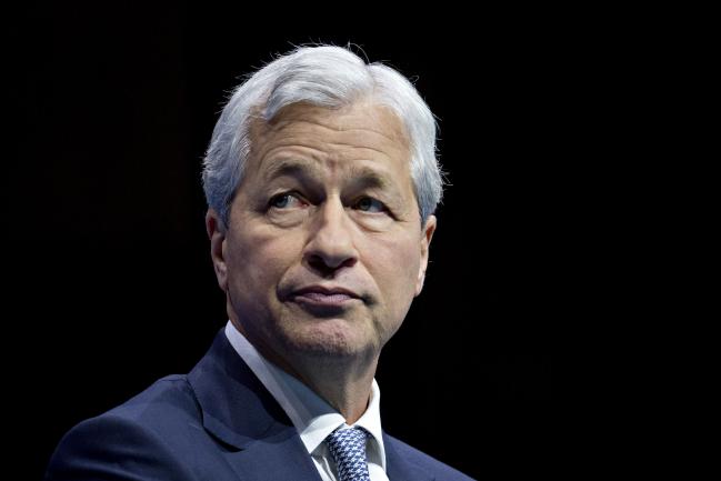 © Bloomberg. Jamie Dimon, chairman and chief executive officer of JPMorgan Chase & Co., listens during a Business Roundtable CEO Innovation Summit discussion in Washington, D.C., U.S., on Thursday, Dec. 6, 2018. The summit features discussions with Americas top chief executive officers, government leaders and industry experts on ideas and policies. Photographer: Andrew Harrer/Bloomberg