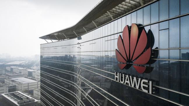 © Bloomberg. The Huawei Technologies Co. logo is displayed atop an office building at the company's production facility in this aerial photograph taken in Dongguan, China, on Thursday, May 23, 2019. Huawei is seeking about $1 billion from a small group of lenders, its first major funding test after getting hit with U.S. curbs that threaten to cut off access to critical suppliers.