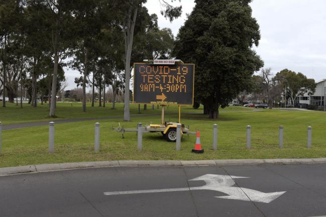 © Bloomberg. A sign directs people to a drive-in Covid-19 testing site set up at the Melbourne Sports and Aquatic Centre in Melbourne, Australia, on Thursday, July 23, 2020. The spike in Victoria has forced around 5 million people in Melbourne back into a six-week lockdown. The shutdown of the nation's second-biggest city, which contributes about one-quarter of gross domestic product, could prolong the nation's first recession in almost three decades. Photographer: Carla Gottgens/Bloomberg