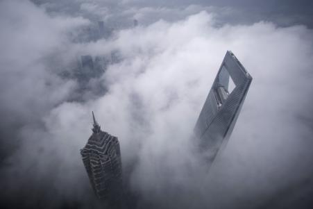 © Reuters/Aly Song. The Shanghai World Financial Center and the Jin Mao Towers rise above low cloud cover. Global wealth inequality in 2015 increased to levels 'possibly not seen for almost a century,' according to Credit Suisse.