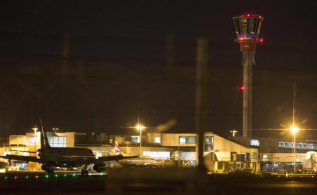 © Reuters/Peter Nicholls. An aircraft taxis next to the control tower at Heathrow airport in London, December 12, 2014. Flights to and from London were severely disrupted on Friday by a technical failure at England's main air traffic control center that forced authorities to limit access to the country's airspace.