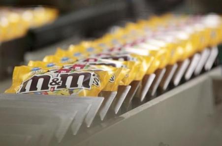 © Reuters/Vincent Kessler. Packets of M&M's chocolates are seen at the production line of candy and chocolate maker Mars Chocolate France's plant in Haguenau, eastern France on Dec. 13, 2011.