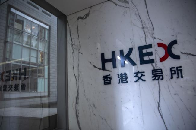 © Bloomberg. Signage for Hong Kong Exchanges & Clearing Ltd. (HKEX) is displayed at the Exchange Square complex in Hong Kong, China, on Monday, Feb. 11, 2019. The bullish mood building in China’s equity market is entering a new phase, with investors flocking to riskier stocks as trading reopened Monday. Photographer: Justin Chin/Bloomberg