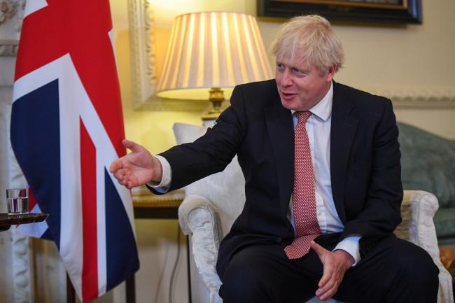 © Bloomberg. Boris Johnson, U.K. prime minister, gestures at the start of his bilateral meeting with Volodymyr Zelenskiy, Ukraine's president, in The Pillard Room in London, U.K., on Thursday, Oct. 8, 2020. Ukraine's central bank governor defended this week’s official reprimands of two of his deputies amid continuing concern over the bank’s independence and a delay in the country’s next slice of aid from the International Monetary Fund.