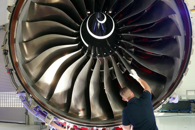 © Bloomberg. An employee inspects a Rolls-Royce Trent XWB engine in Berlin. Photographer: Adam Berry/Getty Images