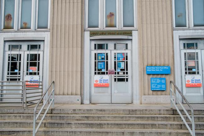 © Bloomberg. A U.S. Post Office in West New York, New Jersey, U.S., on Friday, March 26, 2021. The U.S. economy is on a multi-speed track as minorities in some cities find themselves left behind by the overall boom in hiring, according to a Bloomberg analysis of about a dozen metro areas. Photographer: Gabriela Bhaskar/Bloomberg
