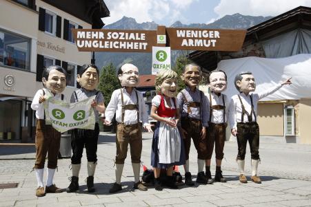 © Reuters/Michaela Rehle. A new study from the IMF has found that rising inequality could hurt the global economy. In this photo, activists of global anti-poverty charity Oxfam, wearing traditional Bavarian lederhosen and a dirndl and masks depicting leaders of the member countries of the G7 (L-R) Italian Prime Minister Matteo Renzi, Japanese Prime Minister Shinzo Abe, French President Francois Hollande, German Chancellor Angela Merkel, U.S. President Barack Obama, British Prime Minister David Cameron and Canadian Prime Minister Stephen Harper, protest prior to the G7 summit in Garmisch-Partenkirchen, southern Germany June 6, 2015.