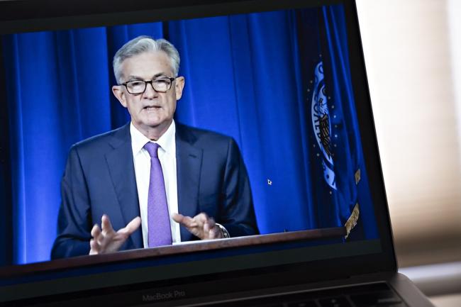 © Bloomberg. Jerome Powell, chairman of the U.S. Federal Reserve, speaks during a virtual news conference seen on a laptop computer in Arlington, Virginia, U.S., on Wednesday, July 29, 2020. Federal Reserve officials left their benchmark interest rate unchanged near zero and again vowed to use all their tools to support the U.S. economy amid a shaky recovery from the coronavirus pandemic.