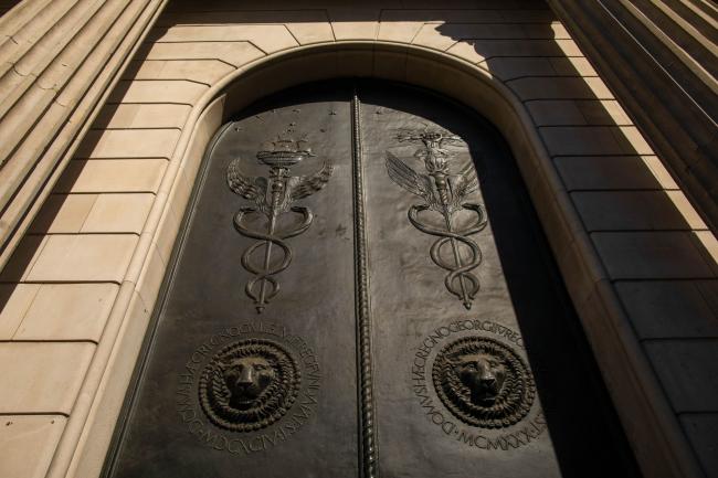 © Bloomberg. Reliefs depicting lions sit display on a door at the Bank of England (BOE) in the City of London, U.K., on Wednesday, May 6, 2020. Bank of England policy makers will meet this week knowing that they'll probably have to do more to combat the U.K.’s economic slump, if not now then soon.