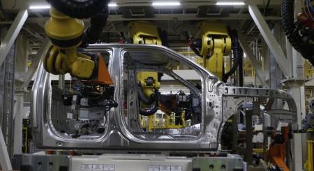 © Reuters/Rebecca Cook. The aluminum cab of a Ford 2015 F-150 pickup truck travels along the new robot assembly line at the Ford Rouge Center in Dearborn, Michigan.