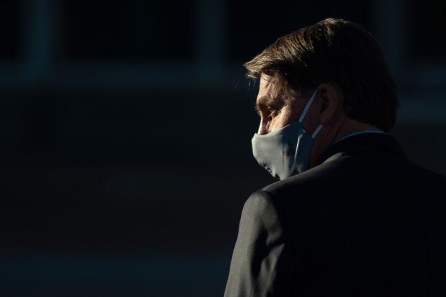 © Bloomberg. BRASILIA, BRAZIL - JUNE 23: Brazilian President Jair Bolsonaro looks on during ceremony to inaugurate the Main Spacial Operations Center (COPE-P) amidst the coronavirus (COVID-19) pandemic at the Comando de Operações Aeroespaciais on June 23, 2020 in Brasilia. Brazil has over 1.145,000 confirmed positive cases of Coronavirus and 52,645 deaths. (Photo by Andressa Anholete/Getty Images) Photographer: Andressa Anholete/Getty Images South America