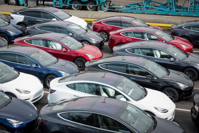 © Bloomberg. Tesla Inc. vehicles sit in a parking lot before being shipped from the Port of San Francisco in San Francisco, California, U.S., on Thursday, Feb. 7, 2019. Tesla is loading as many Model 3 sedans as it can onto vessels destined for China ahead of March 1, when a trade-war truce between presidents Donald Trump and Xi Jinping is scheduled to expire.
