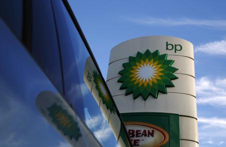 © Reuters/Luke MacGregor. A BP logo is reflected in a car window at a petrol station in London, Jan. 15, 2015.