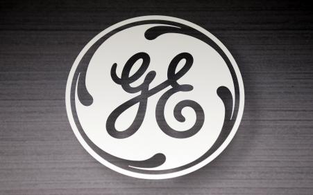 © Reuters/Jim Young. General Electric will pare down its financial services operations by .5 billion while returning  billion to shareholders.