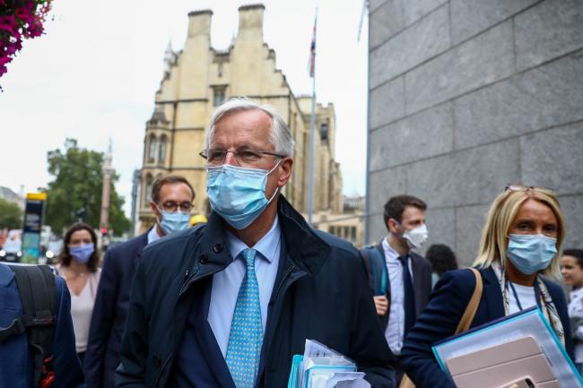 © Bloomberg. Michel Barnier, center left, arrives at the Westminster Conference Center in London on Sept. 9. Photographer: Simon Dawson/Bloomberg