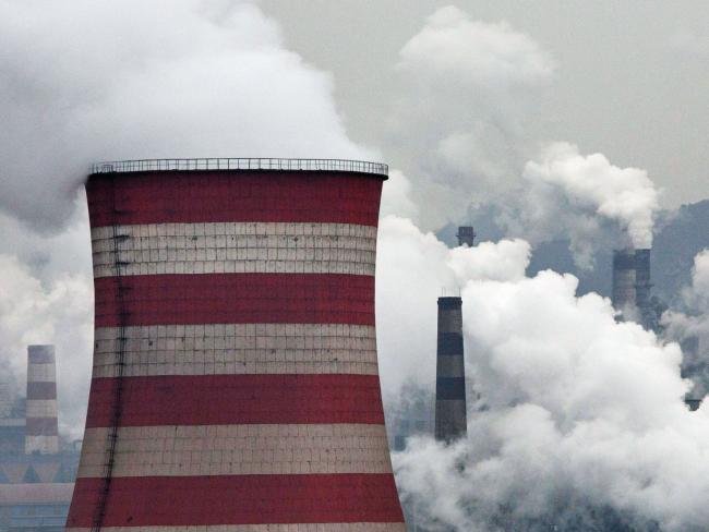 © Bloomberg. HEBEI, CHINA - NOVEMBER 19: Smoke billows from smokestacks and a coal fired generator at a steel factory on November 19, 2015 in the industrial province of Hebei, China. China's government has set 2030 as a deadline for the country to reach its peak for emissions of carbon dioxide, what scientists and environmentalists cite as the primary cause of climate change. At an upcoming conference in Paris, the governments of 196 countries will meet to set targets on reducing carbon emissions in an attempt to forge a new global agreement on climate change. (Photo by Kevin Frayer/Getty Images) Photographer: Kevin Frayer/Getty Images AsiaPac