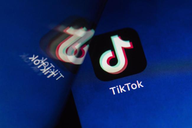© Bloomberg. ByteDance Ltd.'s TikTok app button, reflected in a mirror, is arranged for a photograph on a smartphone in Sydney, New South Wales, Australia, on Monday, Sept. 14, 2020. Oracle Corp. is the winning bidder for a deal with TikTok’s U.S. operations, people familiar with the talks said, after main rival Microsoft Corp. announced its offer for the video app was rejected.