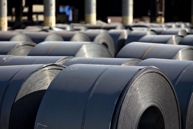 © Bloomberg. Steel coils sit outside at the U.S. Steel Corp. Granite City Works facility in Granite City, Illinois, U.S., on Thursday, July 26, 2018. U.S. President Donald Trump celebrated U.S. Steel Corp's decision to re-employ hundreds of laid-off workers and lamented decades of past leaders' trade policies. Photographer: Daniel Acker/Bloomberg