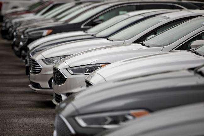 © Bloomberg. 2020 Ford Motor Co. Fusion vehicles are displayed at a car dealership in Orland Park, Illinois, U.S., on Friday, Sept. 27, 2019. Auto sales in the U.S. probably took a big step back in September, setting the stage for hefty incentive spending by carmakers struggling to clear old models from dealers' inventory. Photographer: Daniel Acker/Bloomberg