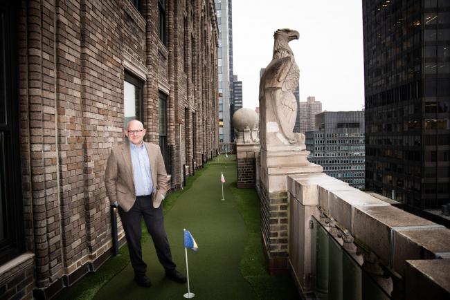 © Bloomberg. Hans Humes, chief executive officer of Greylock Capital Management LLC, stands for a photograph on a putting green outside his office in New York, U.S., on Friday, Dec. 13, 2019. Some foreign investors are worried by Argentina Economy Minister Martin Guzman's lack of political experience and by his 