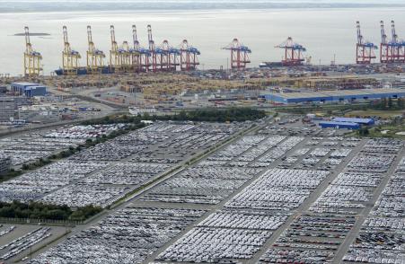 © Reuters/Fabian Bimmer. GDP growth for Germany and the eurozone slowed in the third quarter of 2015. Pictured: Cars for export stand in a parking area at a shipping terminal in the harbour of the German northern town of Bremerhaven on Oct. 8, 2012.