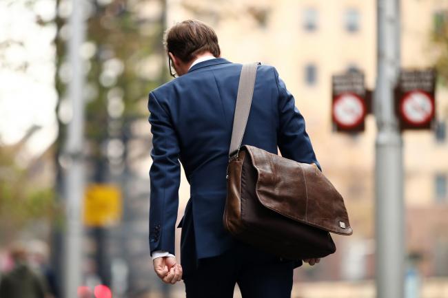 © Bloomberg. A commuter walks through the central business district of Sydney, Australia, on Monday, May 20, 2019. Prime Minister Scott Morrison's center-right government will command a parliamentary majority, the Australian Broadcasting Corp. projected Monday, fueling a stock market rally as investors welcomed his surprise victory in the weekend election. Prime Minister Scott Morrison's center-right government will command a parliamentary majority, the Australian Broadcasting Corp. projected Monday, fueling a stock market rally as investors welcomed his surprise victory in the weekend election. Photographer: Brendon Thorne/Bloomberg