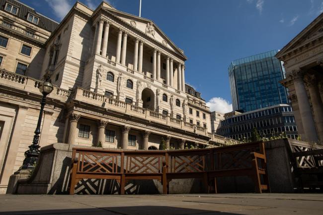 © Bloomberg. Empty benches sit outside the Bank of England (BOE) in the City of London, U.K., on Wednesday, May 6, 2020. Bank of England policy makers will meet this week knowing that they'll probably have to do more to combat the U.K.’s economic slump, if not now then soon. Photographer: Simon Dawson/Bloomberg