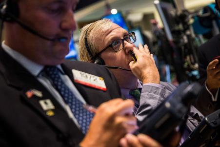 © Getty Images/Andrew Burton. Traders work on the floor of the New York Stock Exchange during the afternoon of Sept. 2, 2015, in New York City.