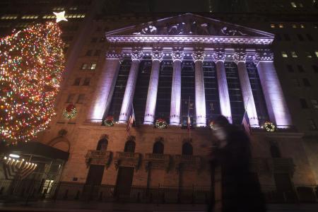 © Reuters/Carlo Allegri. The Dow Jones Industrial Average closed below the 18,000 milestone Wednesday the final day of trading in 2014, but gained 7.52 percent for the year, booking 38 record-closing highs.