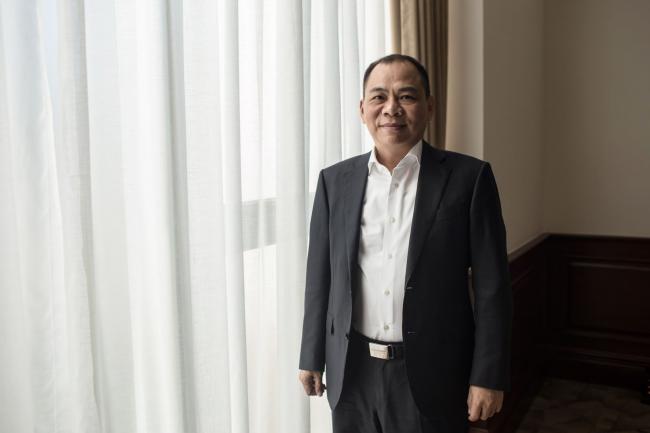 © Bloomberg. Pham Nhat Vuong, chairman of Vingroup JSC, poses for a photograph in Hanoi, Vietnam, on Thursday, Dec. 5, 2019. Vuong, the billionaire behind six-month-old Vietnamese auto startup�VinFast,�plans a feat even�Toyota Motor Corp.�and�Hyundai Motor Co.�couldn't pull off during their early days: sell a car in the U.S. Photographer: Yen Duong/Bloomberg
