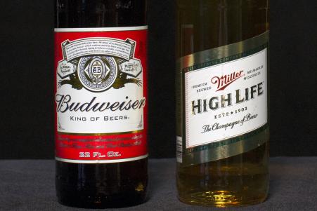 © Reuters. A bottle of Budweiser and a bottle of Miller High Life are pictured together in this Oct. 14, 2015, photo. The world's top two brewers, Anheuser-Busch InBev and SABMiller, are reportedly poised to announce their final merger agreement Wednesday.