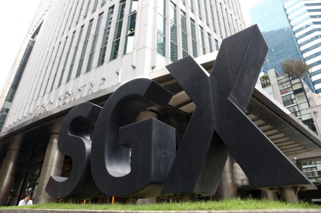 © Bloomberg. Signage for the SGX Centre, which houses the Singapore Exchange Ltd. (SGX) headquarters, stands in Singapore, on Friday, April 27, 2018. Southeast Asian leaders agreed to work intensively toward an agreement by the end of this year on plans to create what could potentially be the world’s biggest trading bloc. Photographer: Paul Miller/Bloomberg