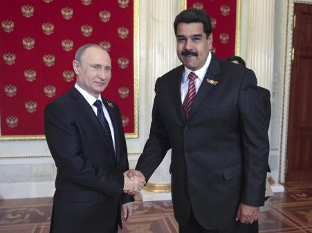 © Reuters/Host Photo Agency/RIA Novosti. Russian President Vladimir Putin told Venezuelan President Nicolas Maduro during a meeting in Beijing that their countries must work together to stabilize oil prices. Above, the two presidents in the Kremlin in Moscow, Russia, May 9, 2015.