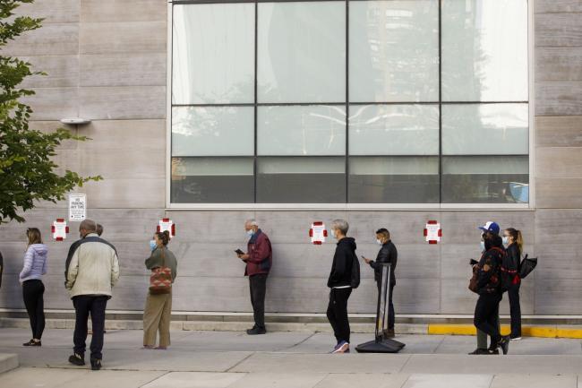© Bloomberg. People wait in line outside a Covid-19 testing center at Women's College Hospital in Toronto, Ontario, Canada, on Friday, Sept. 18, 2020. Ontario Health Minister Christine Elliott said that testing demand has risen 30 per cent across the province in recent weeks, resulting in long lines at some assessment centres, CTV News reports.