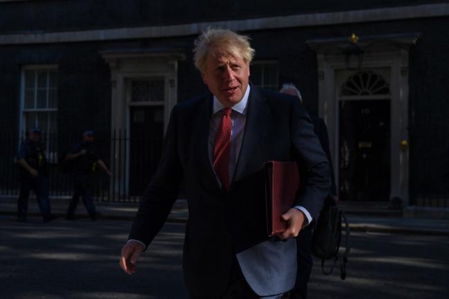 © Bloomberg. Boris Johnson, U.K. prime minister, arrives for the first in-person cabinet meeting since U.K. Prime Minister Boris Johnson encouraged people to return to work in London, U.K., on Tuesday, July 21, 2020. Senior lawmakers will seek to use a visit to London by U.S. Secretary of State Michael Pompeo to press Johnson to take an even harder stance on China.