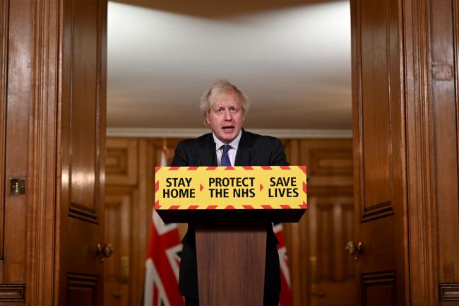 © Bloomberg. LONDON, ENGLAND - JANUARY 22: UK Prime Minister Boris Johnson speaks during a coronavirus press conference at 10 Downing Street on January 22, 2021 in London, England. The Prime Minister announced that the new variant of COVID-19, which was first discovered in the south of England, appears to be linked with an increase in the mortality rate. (Photo by Leon Neal/Getty Images) Photographer: Leon Neal/Getty Images