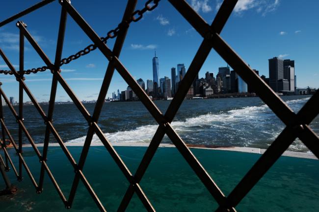 © Bloomberg. NEW YORK CITY, - MARCH 24: Manhattan sits under a blue sky as most of the city is in lockdown due to the cornoavirus on March 24, 2020 in New York City. Across the country schools, businesses and places of work have either been shut down or are restricting hours of operation as health officials try to slow the spread of COVID-19. (Photo by Spencer Platt/Getty Images)