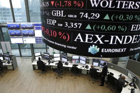 © Benoit Tessier/Reuters. Global share prices shrugged off mixed data out of China. Above, stock-market operator Euronext's universal analysts work in the market-services surveillance room center at the new Euronext headquarters at La Defense business and financial district in Courbevoie outside Paris Oct. 30, 2015.<br/>