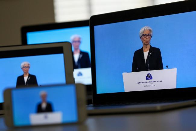 © Bloomberg. Christine Lagarde, president of the European Central Bank (ECB), speaks during a live stream video of the central bank's virtual rate decision news conference in Frankfurt, Germany, on various screens arranged in Danbury, U.K., on Thursday, March 11, 2021. The central bank’s immediate focus is on keeping financial conditions favorable. Photographer: Chris Ratcliffe/Bloomberg