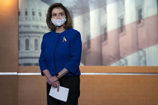 © Bloomberg. U.S. House Speaker Nancy Pelosi, a Democrat from California, wears a protective mask during a news conference at the U.S. Capitol on Wednesday, Sept. 23, 2020. The U.S. House passed a stopgap funding bill to keep the government operating through Dec. 11 after both parties in Congress and officials at the White House struck a deal to provide aid to farmers and food assistance for low-income families. Photographer: Stefani Reynolds/Bloomberg