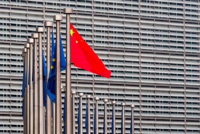 &copy Bloomberg. China’s national flag, flies in front of European Union (EU) flags outside the Berlaymont building during the EU-China summit in Brussels, Belgium, on Tuesday, April 9, 2019. The EU and China managed to agree on a joint statement for Tuesday’s summit in Brussels, papering over divisions on trade in a bid to present a common front to U.S. President Donald Trump, EU officials said.