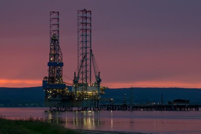 © Bloomberg. A mobile offshore drilling unit stands illuminated at night in the Port of Cromarty Firth in Cromarty, U.K., on Tuesday, June 23, 2020. Oil headed for a weekly decline -- only the second since April -- as a surge in U.S. coronavirus cases clouded the demand outlook, though the pessimism was tempered by huge cuts to Russia's seaborne crude exports. Photographer: Jason Alden/Bloomberg